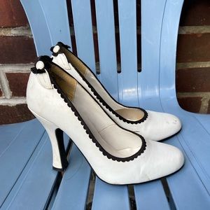 White burlesque type pumps